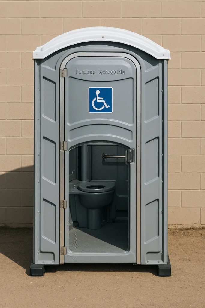 ADA-compliant portable toilet with wide doorway, wheelchair symbol, ground-level entry, and grab bar – ideal for accessible event or jobsite sanitation.